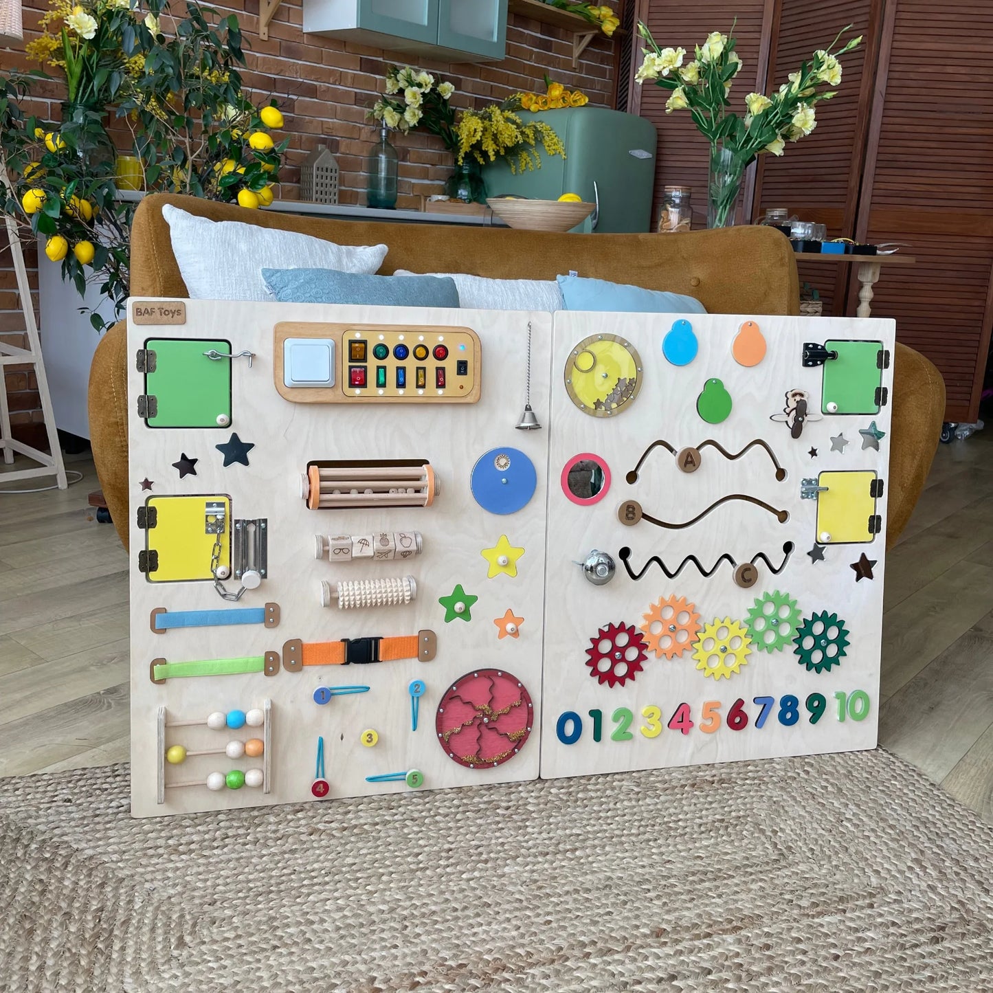 Bright colorful sensory wall panel for kids with lights, locks, gears, and learning elements. Great for special needs, autism support, preschool classrooms, and fine motor skills development