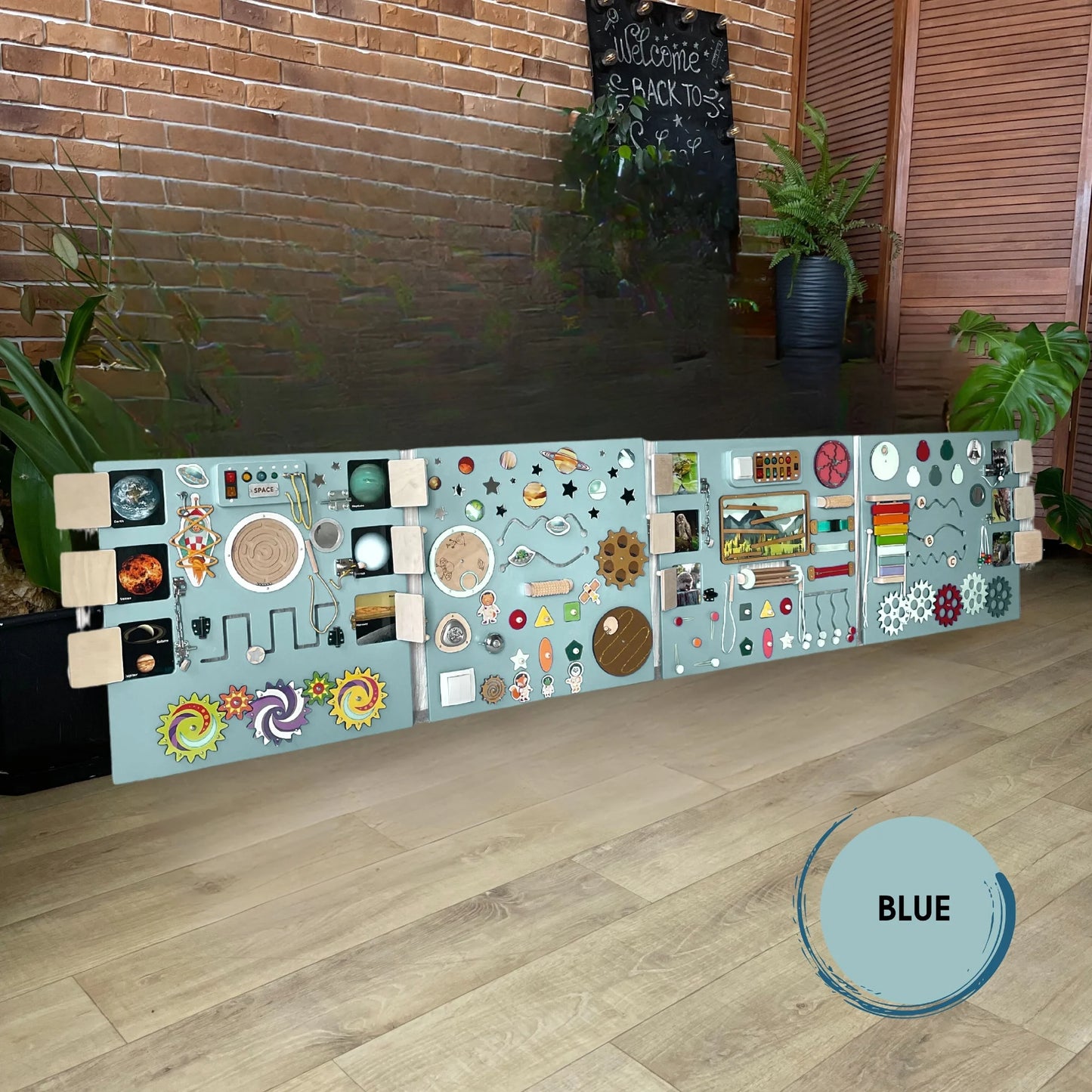 Extra-large sensory wall panel in blue color theme with space and mountains activities, ideal for classrooms and therapy centers