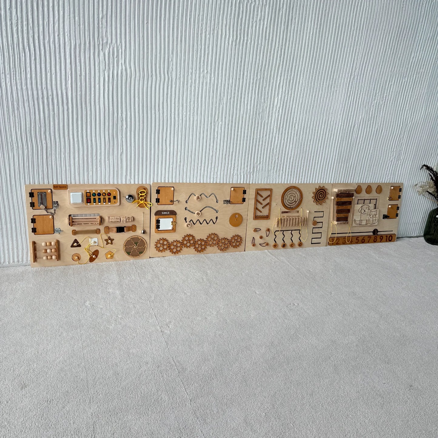 Natural wooden sensory wall panel mounted on white wall, full view of 4 connected sections