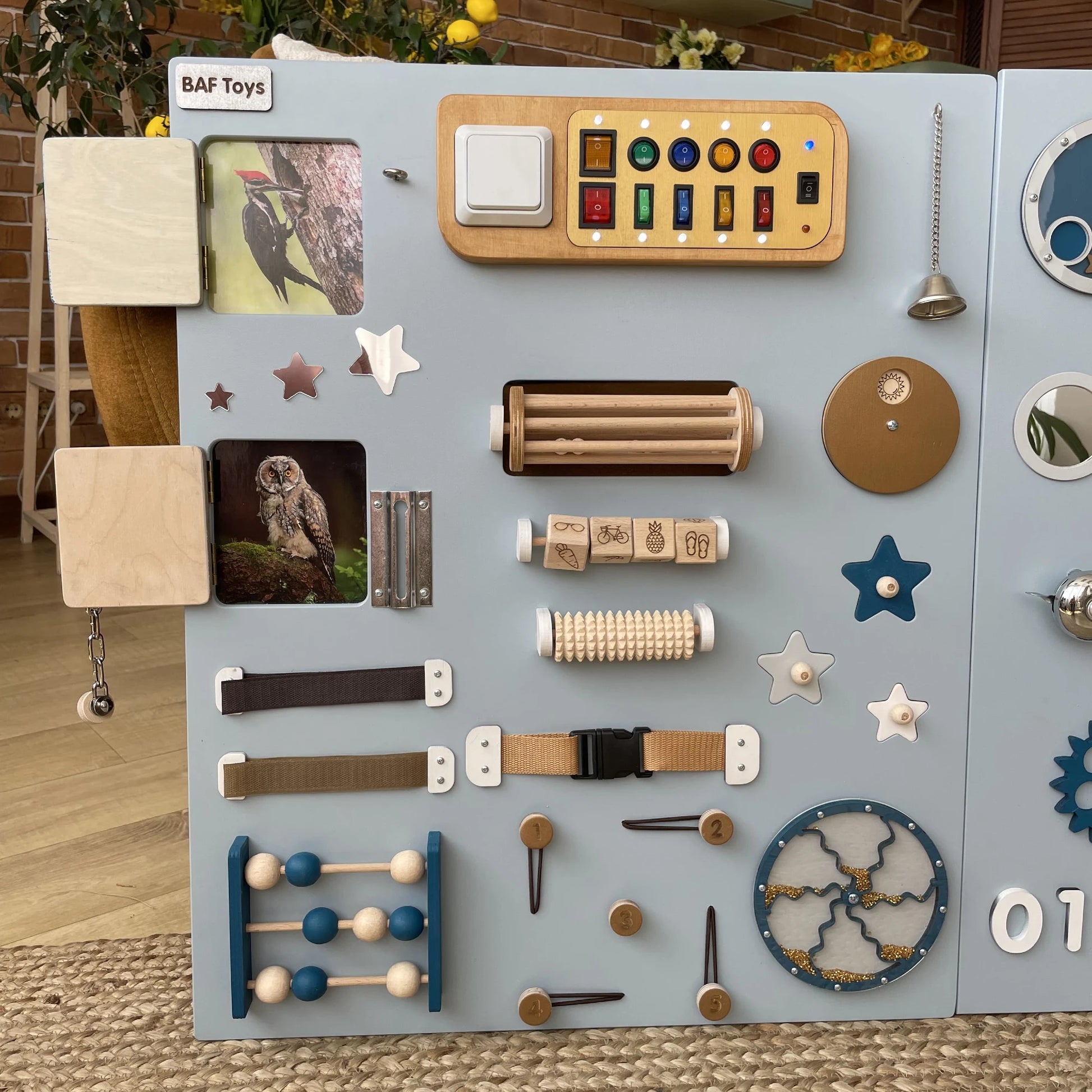 120x70cm blue nature sensory board placed in bright living room, equipped with fine motor activities