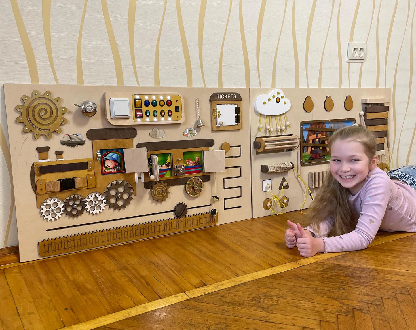 Train theme sensory wall panels in a school hallway. Sensory toys for autism and engaging classroom sensory equipment.