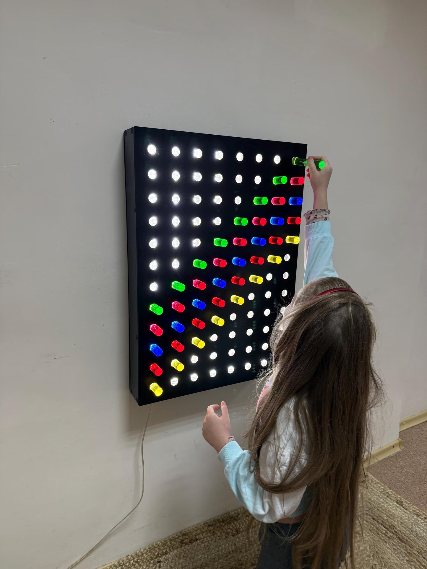 Front view of Giant Light Peg Board With Acrylic Rods | Light Panel Sensory Wall glowing with 96 acrylic rods – calming sensory room feature
