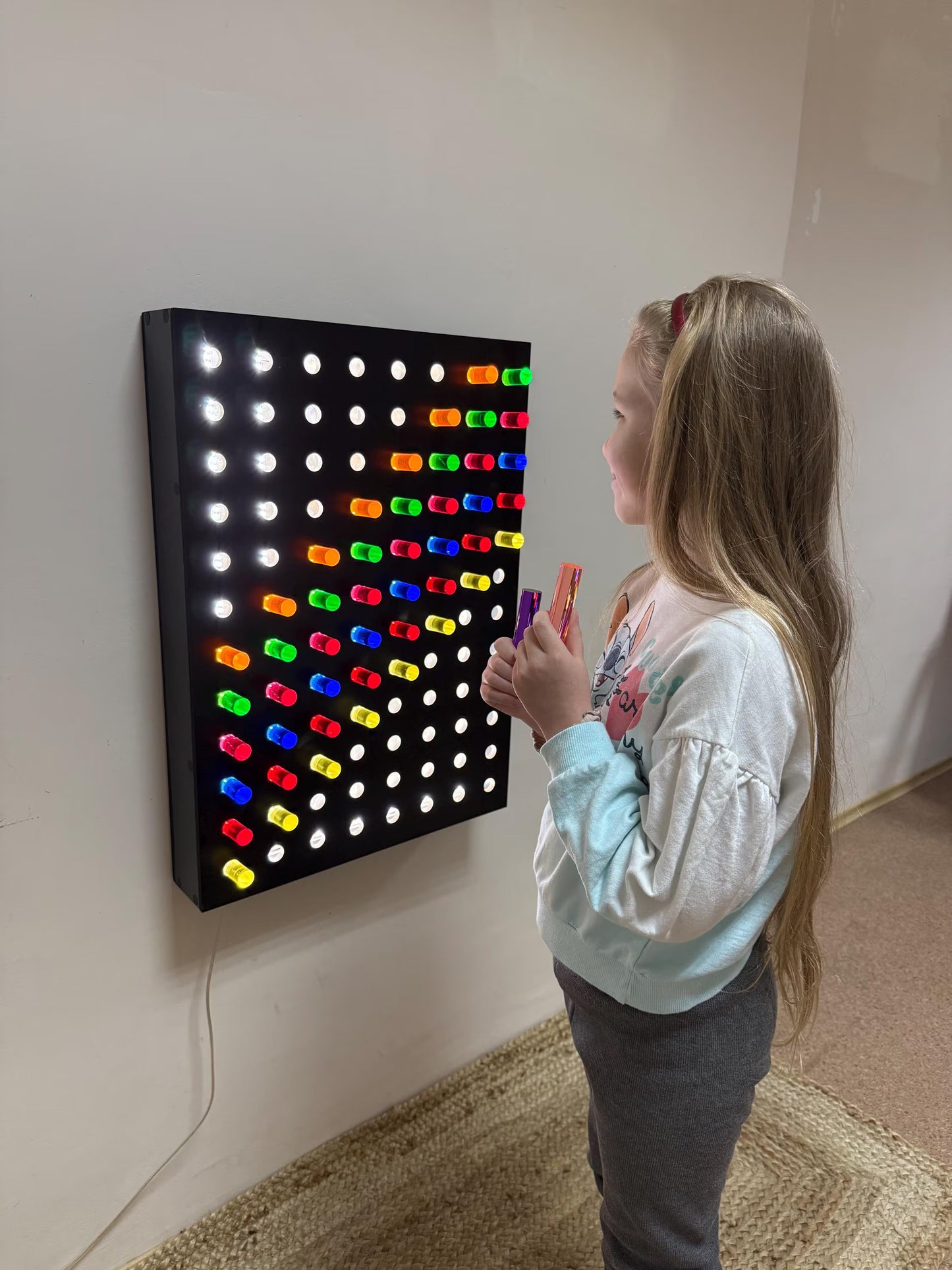 Side view of Giant Light Peg Board With Acrylic Rods | Light Panel Sensory Wall mounted on wall – Montessori sensory board with glowing acrylic pegs
