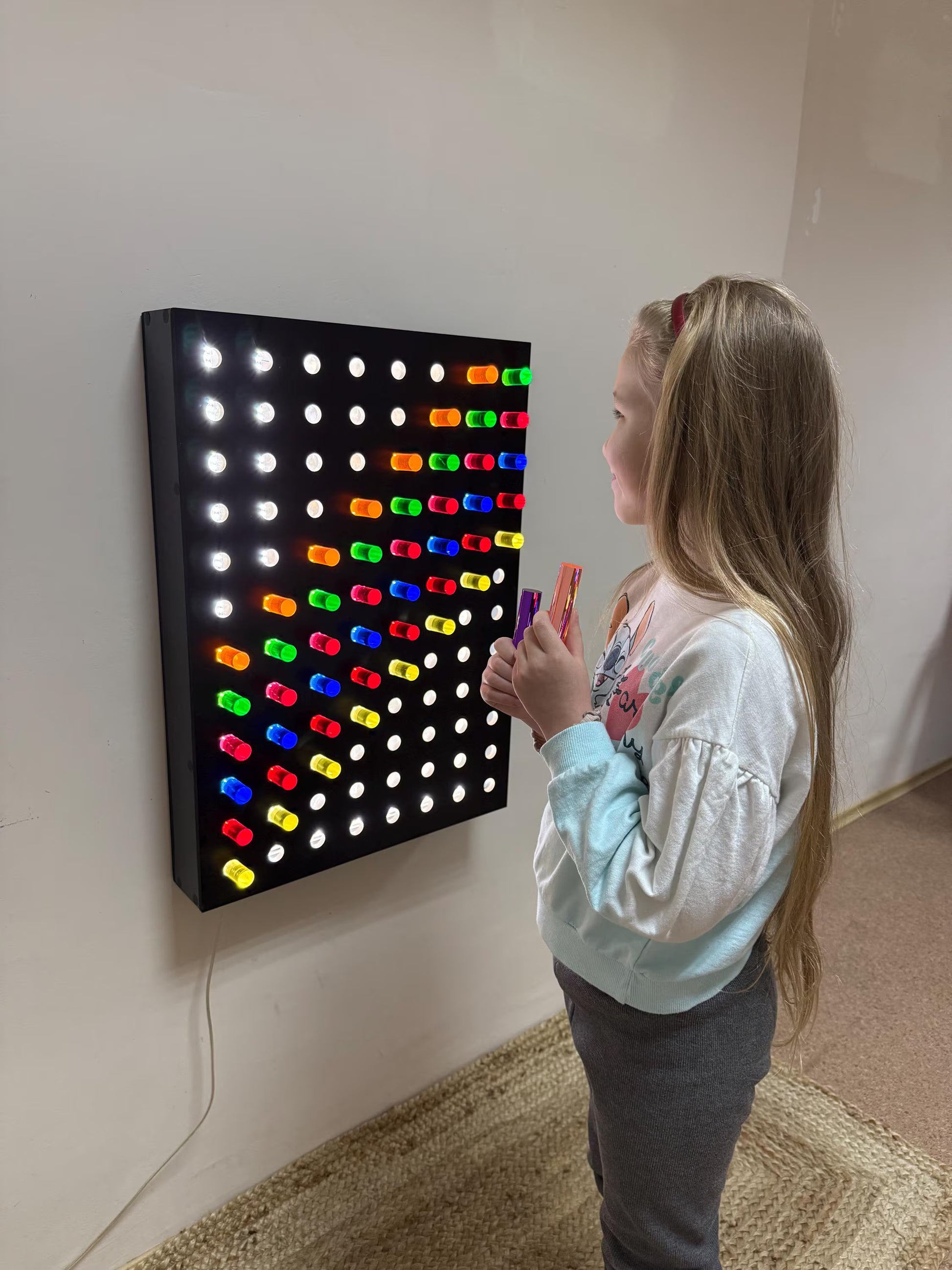Side view of Giant Light Peg Board With Acrylic Rods | Light Panel Sensory Wall mounted on wall – Montessori sensory board with glowing acrylic pegs

