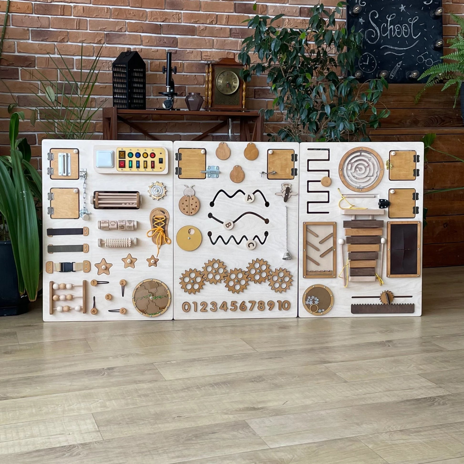View of the sensory wall panel highlighting gears, switches, and interactive elements for sensory play.