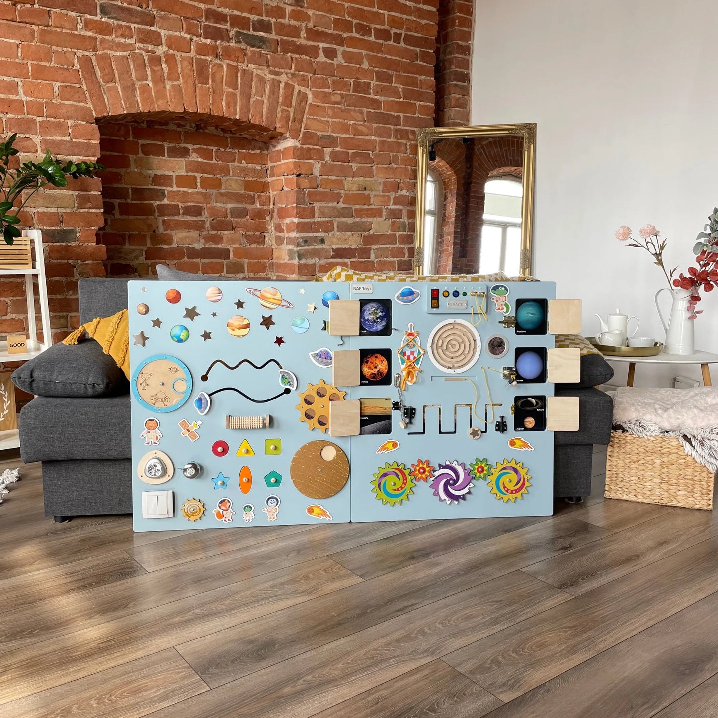 Large space-themed sensory wall panel – Sky Blue. Includes opening doors, LED lights, switches, and interactive elements for fine motor skills and logic
